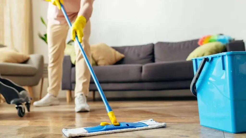 Person performing a professional deep cleaning on a floor.