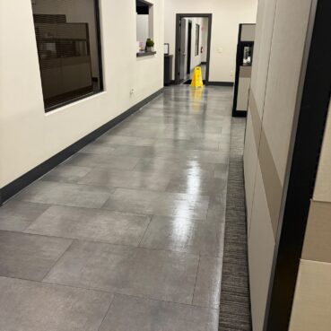 Polished commercial hallway floor after janitorial floor care by Vieira Cleaning