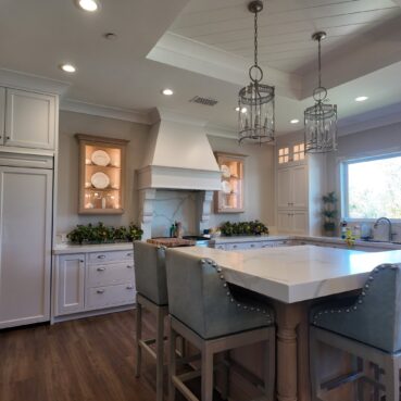 Spacious kitchen with spotless marble counters and cabinets cleaned by Vieira Cleaning